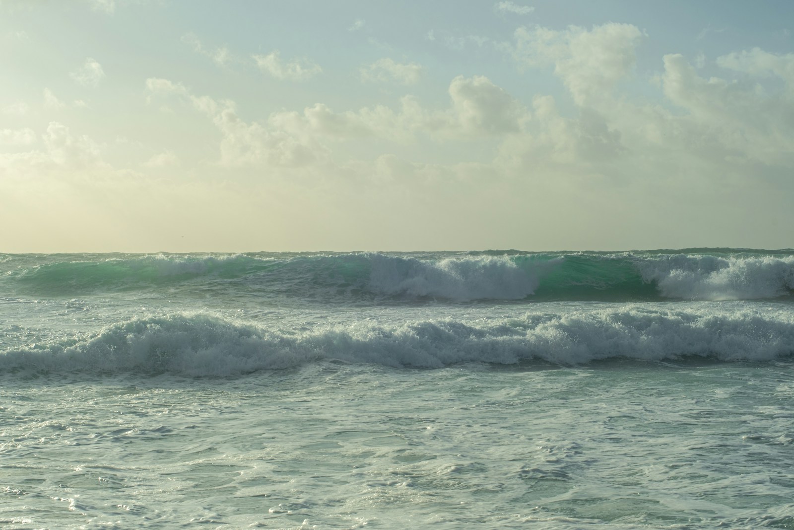 a large body of water with waves coming in